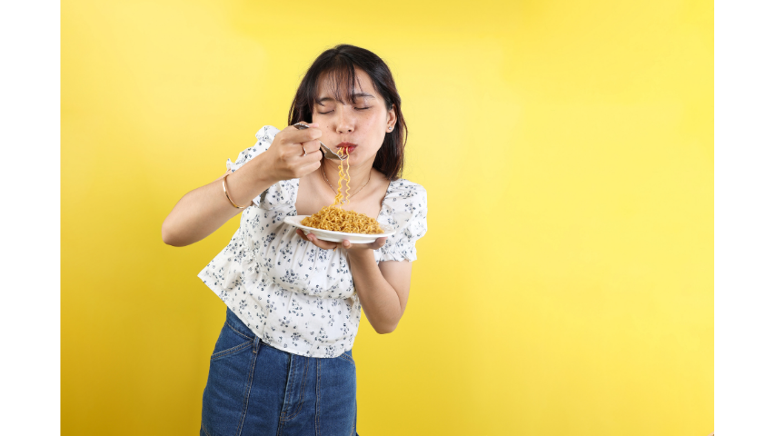 Girl Eating Mi Sedaap Happily